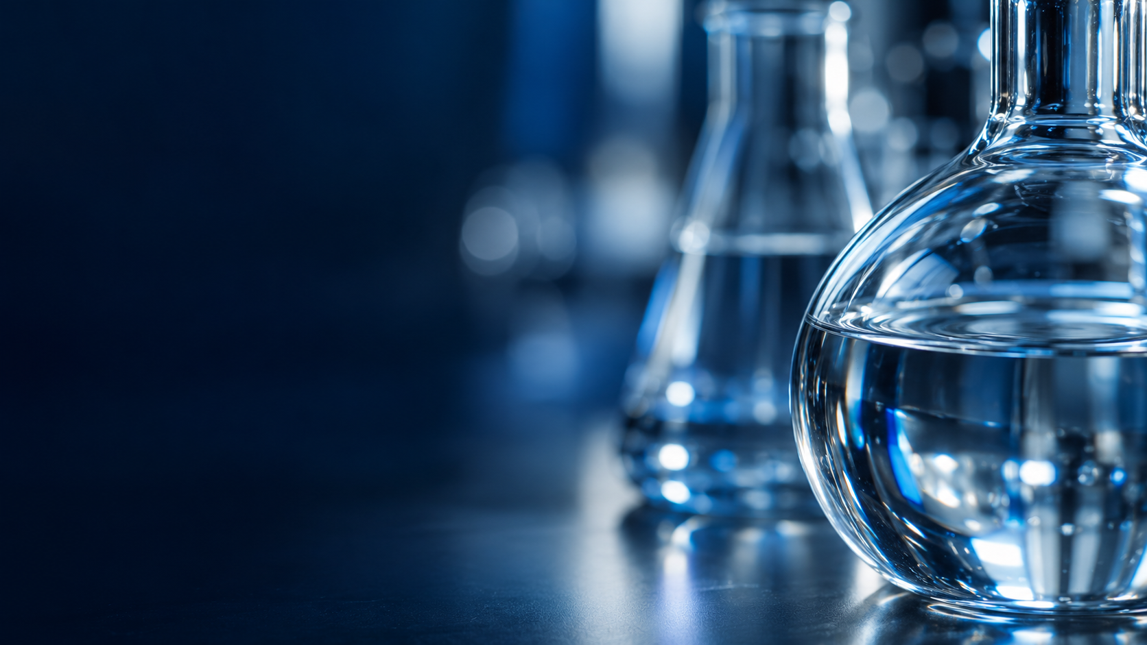 Illustrative laboratory glass flasks with blue refractions.
